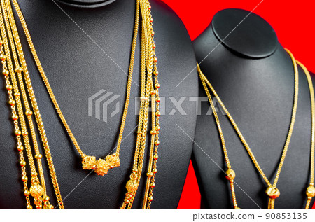 The Necklace display stand with gold necklace on red Velvet fabric. The Necklace display stand with gold necklace on red Velvet fabric. 90853135