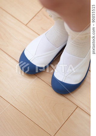 Girls' feet wearing slippers Girls' feet wearing slippers 90855515