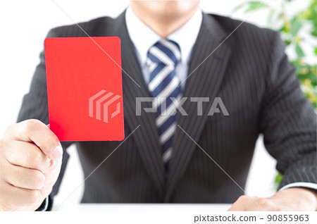 Man with red card 90855963