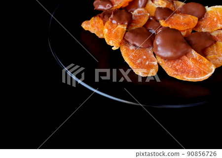 Chocolate-covered dry oranges 90856726