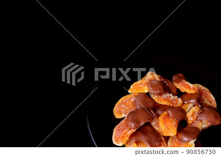Chocolate-covered dry oranges Chocolate-covered dry oranges 90856730