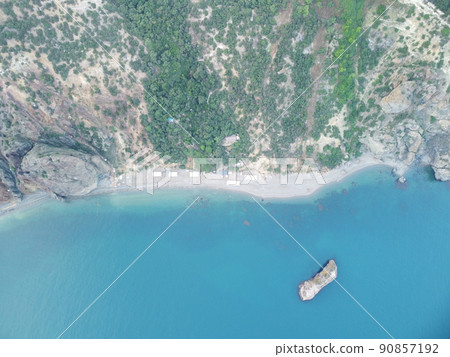Aerial view. Blue sky sun and fog over calm sea. The drone flies over foggy and fluffy clouds. Abstract aerial nature summer ocean sunset sea and sky background. Vacation, travel and holiday concept. Aerial view. Blue sky sun and fog over calm sea. The drone flies over foggy and fluffy clouds. Abstract aerial nature summer ocean sunset sea and sky background. Vacation, travel and holiday concept. 90857192