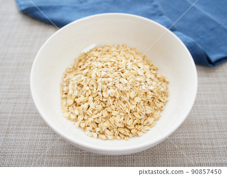 Granular oatmeal [rolled oats, traditional oats] _02 served in a white bowl 90857450