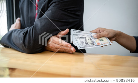 Businessman is receive banknote money and terms of contract from bribe employer in signing contract 90858416