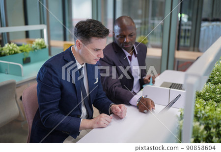 Business people in the workplace are discussing a working strategy for doing business 90858604