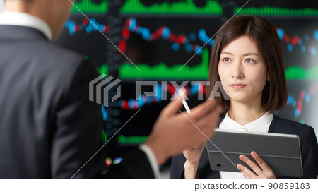 Business person having a meeting in front of the chart screen Business person having a meeting in front of the chart screen 90859183