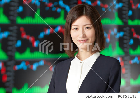 Business woman securities analyst trader image standing in front of the chart screen 90859185
