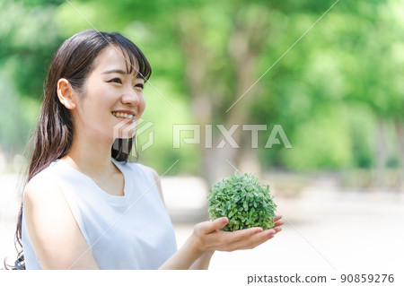 Japanese woman with a plant (profile) 90859276