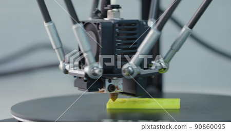 3D Printing Machine printing a piece of plastic 3D Printing Machine printing a piece of plastic 90860095
