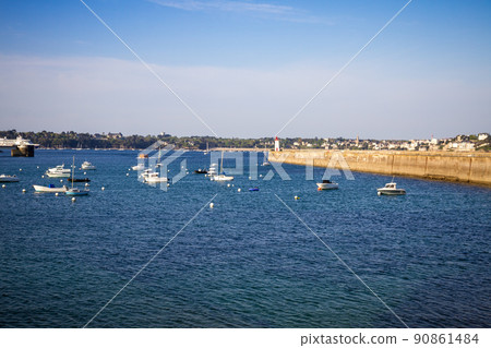 Saint-Malo lighthouse and pier view from the city fortifications, Brittany, France 90861484