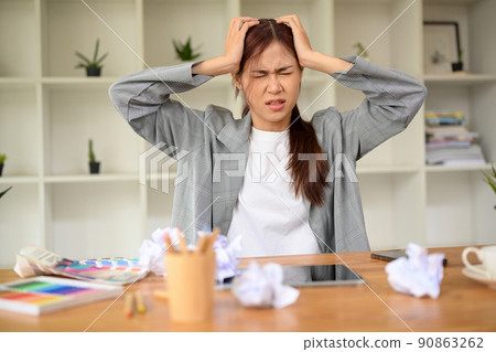 Angry stressed young asian female graphic designer frustrated with her work project 90863262