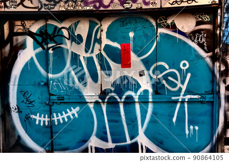 Blue graffiti drawn on the wall 90864105