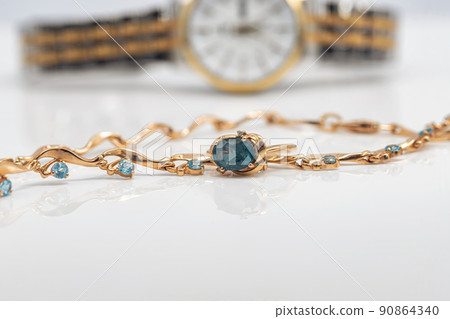 Accessories and jewelry for a fashionable girl : gold ring, necklace and original wristwatch Accessories and jewelry for a fashionable girl : gold ring, necklace and original wristwatch 90864340