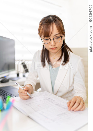 Young female first-class architect independent architectural design office glasses 90864702