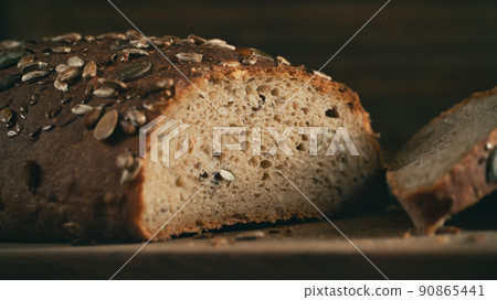 Close-up of homemade whole grain bread crumb with seeds. Selective focus 90865441