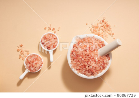 Top view of halit himalaya decorated in petri dish and bowl in orange background  90867729