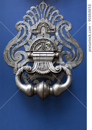 Close up of a mansion blue wooden door 90868658