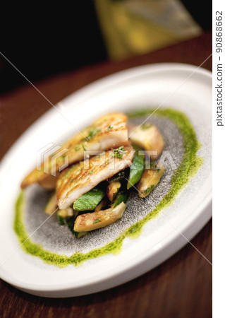 Fish dish on a table in a French bistro Fish dish on a table in a French bistro 90868662