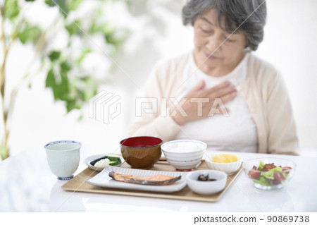 Image of senior woman without appetite 90869738