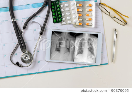 Doctor checks digital monitor on x-ray the correct installation of a pacemaker in office medical Doctor checks digital monitor on x-ray the correct installation of a pacemaker in office medical 90870095