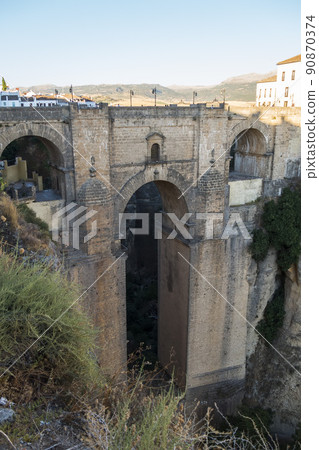 View of Ronda old stone bridge, Malaga, Spain View of Ronda old stone bridge, Malaga, Spain 90870374