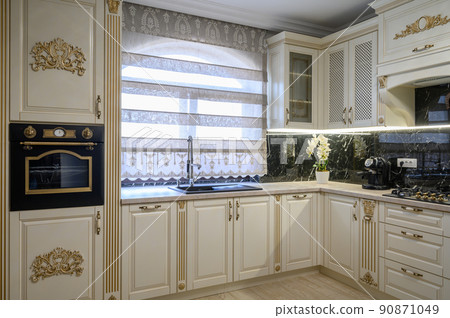White classic cozy kitchen and dining room in city house White classic cozy kitchen and dining room in city house 90871049