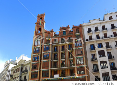 Facade of a building. Residential building with balconies. 90871510