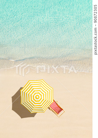 Top view of sunbed, lounge, yellow umbrella, SUP board for surfing on the shore on tropical Seychelles sand beach. Blue, turquoise transparent water surface of ocean, sea, lagoon. Aerial, drone view. Top view of sunbed, lounge, yellow umbrella, SUP board for surfing on the shore on tropical Seychelles sand beach. Blue, turquoise transparent water surface of ocean, sea, lagoon. Aerial, drone view. 90872305