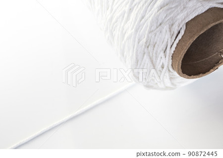 Roll of white rope isolated on white background 90872445