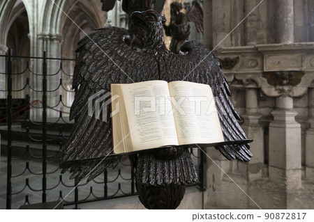DIEPPE, FRANCE - FEBRUARY 05, 2019: An open bible on a stand in the shape of an eagle in a Saint-Jacques Church DIEPPE, FRANCE - FEBRUARY 05, 2019: An open bible on a stand in the shape of an eagle in a Saint-Jacques Church 90872817