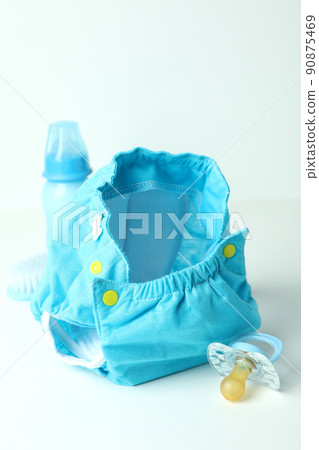 Concept of baby clothes with reusable diapers on white table 90875469