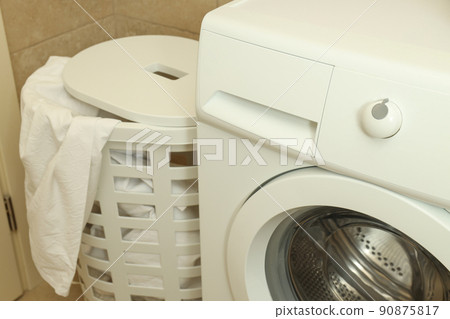 Concept of housework with washing machine in bathroom Concept of housework with washing machine in bathroom 90875817