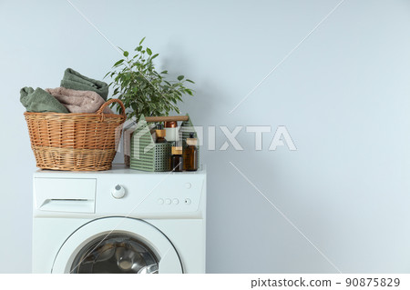 Concept of housework with washing machine on white background 90875829