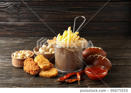 Concept of Super bowl snacks on dark table Concept of Super bowl snacks on dark table 90875850