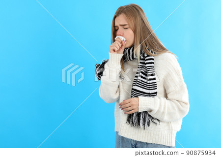 Sick girl on blue background, seasonal cold concept Sick girl on blue background, seasonal cold concept 90875934