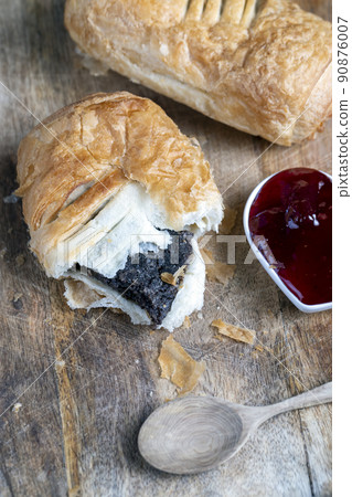 puff pastry bun made of wheat dough and poppy seed filling puff pastry bun made of wheat dough and poppy seed filling 90876007