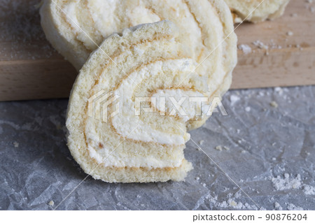 a rolled roll of soft cake and sweet curd filling 90876204
