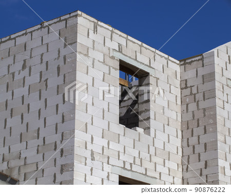 construction site on which a new modern building is being built 90876222