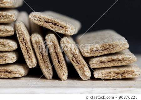 waffle sweets stuffed with grated fruit on the table 90876223