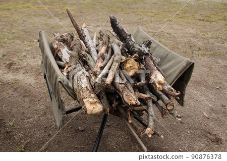 Dead branches, twigs, and firewood for bonfires collected at the campsite 90876378