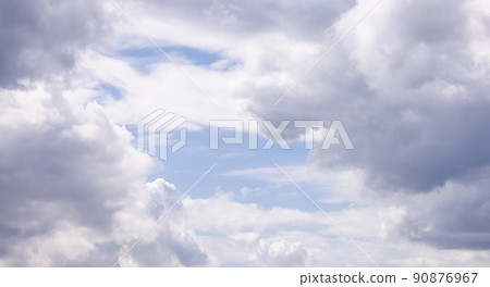 View of Cloudscape during a cloudy blue sky sunny day. 90876967