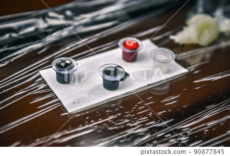 Tattoo artist posing in studio 90877845