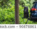 part of a pickup truck in the woods 90878861