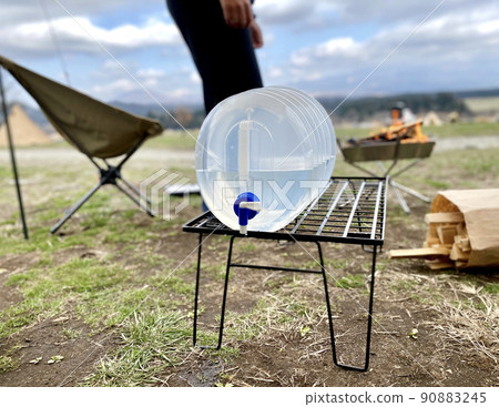 Folding water jug placed in the campsite 90883245