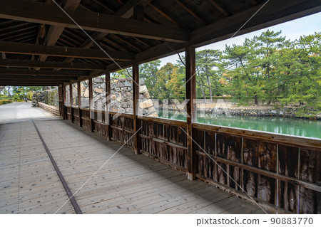 Moat and Ishigaki seen from the sheath bridge of Takamatsu Castle, Takamatsu City, Kagawa Prefecture 90883770