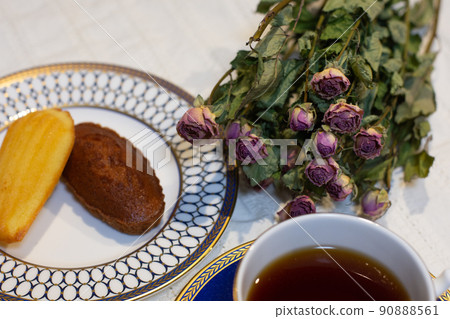 Tea time tea and pastry madeleine and financier dried flower table coordination 90888561