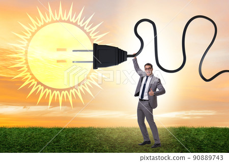Businessman in solar energy concept 90889743