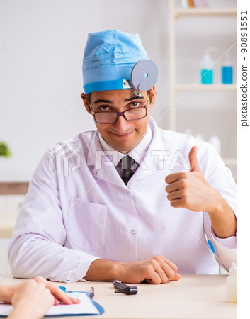 The young woman visting male doctor otolaryngologist The young woman visting male doctor otolaryngologist 90891551