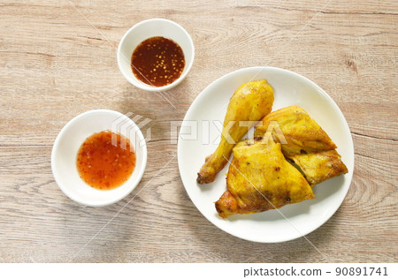 grilled chop chicken on plate dipping with spicy and sweet chili sauce  90891741