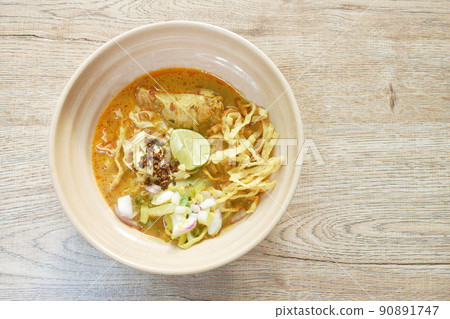 Thai northern style curry noodles in coconut milk soup with chicken on bowl 90891747